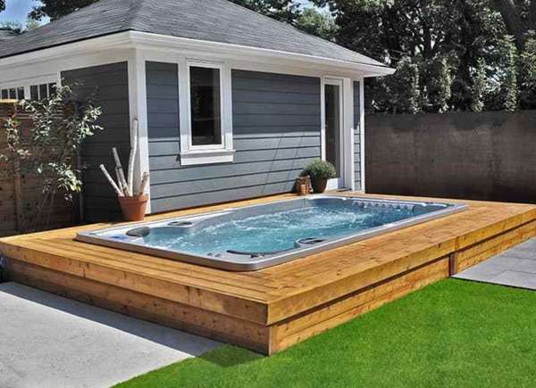 A bench surrounding the hot tub, giving off a nice clean, modern look and functionality