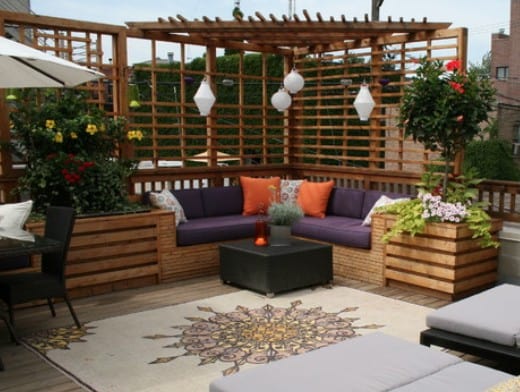 L-shaped lounge with pergola on a rooftop balcony