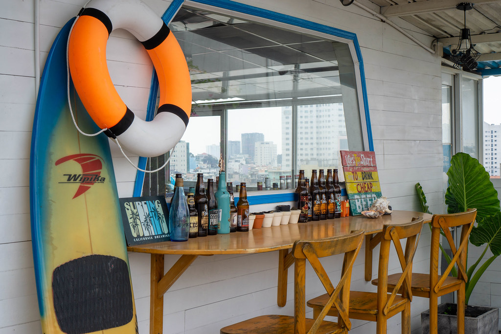 Nautical-themed rooftop pub with a city view