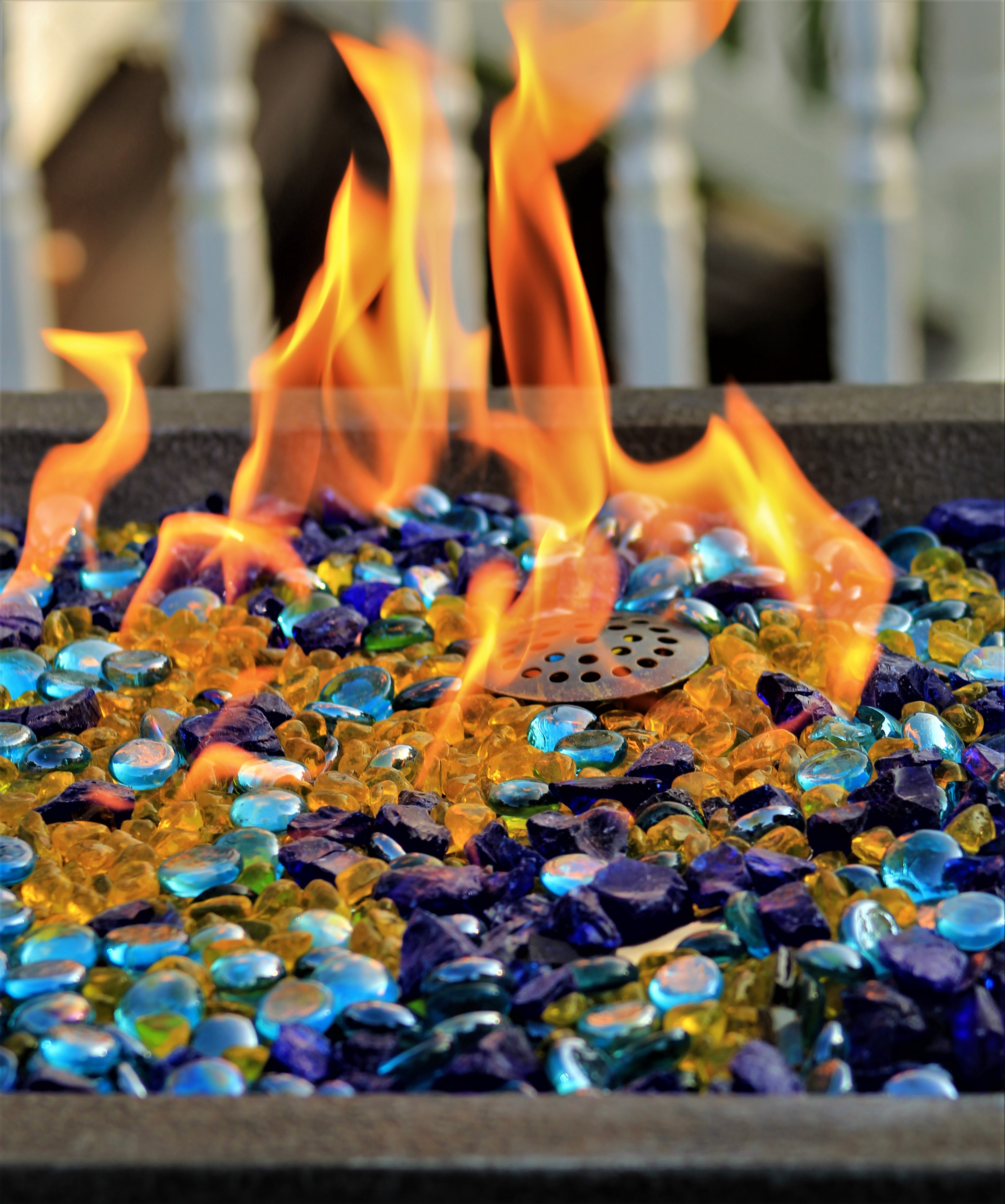 Fire pit lit by bio fuel blue stones