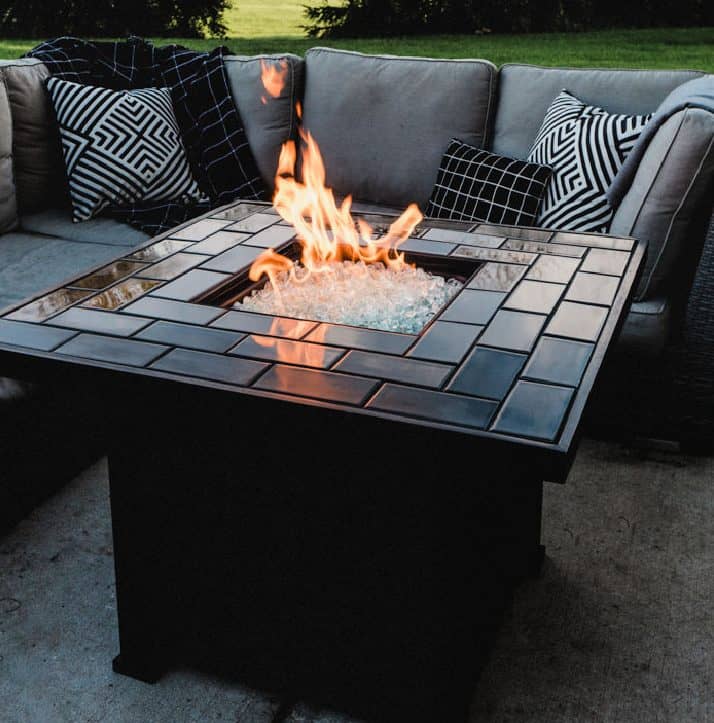 Modern fire pit with black grout and tile