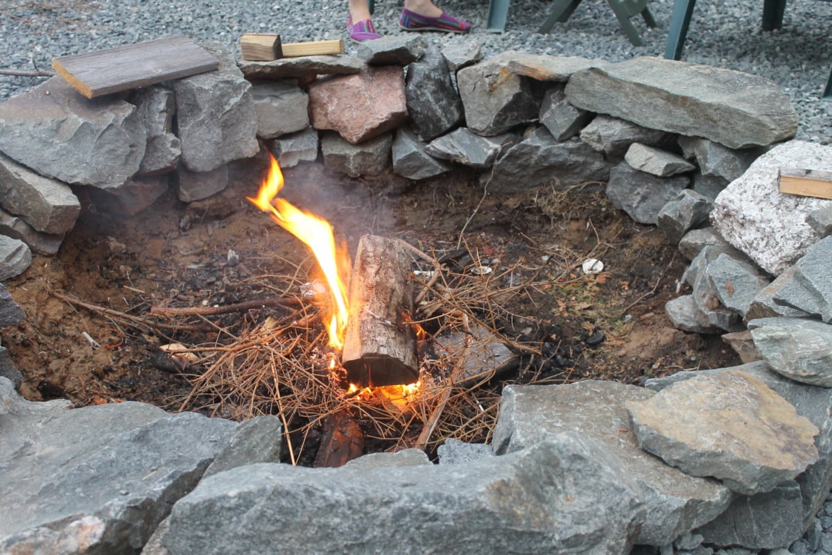 Fire pit with raw material sources
