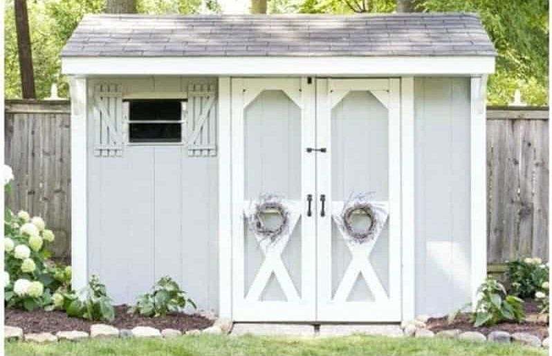 An old shed transformed into a farmhouse-style paint job
