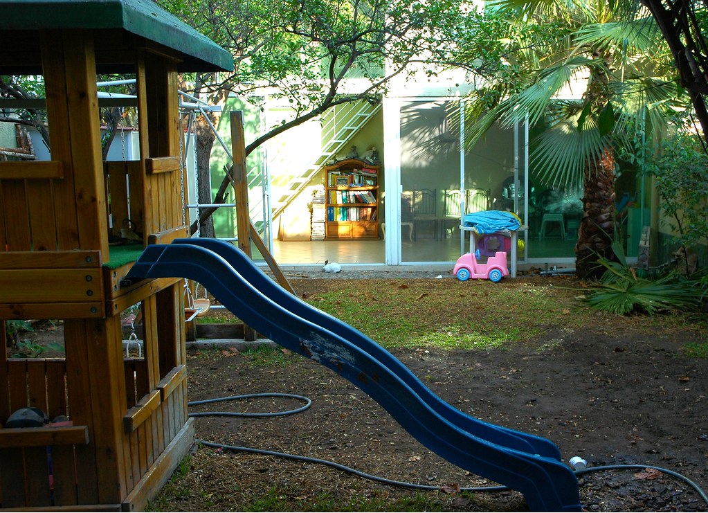 Backyard playground with a mini slide