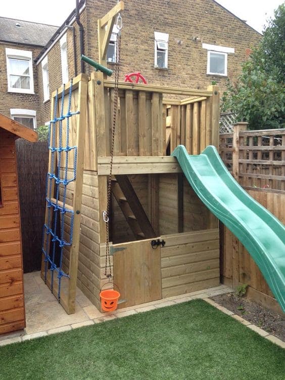 Wooden treehouse in small garden
