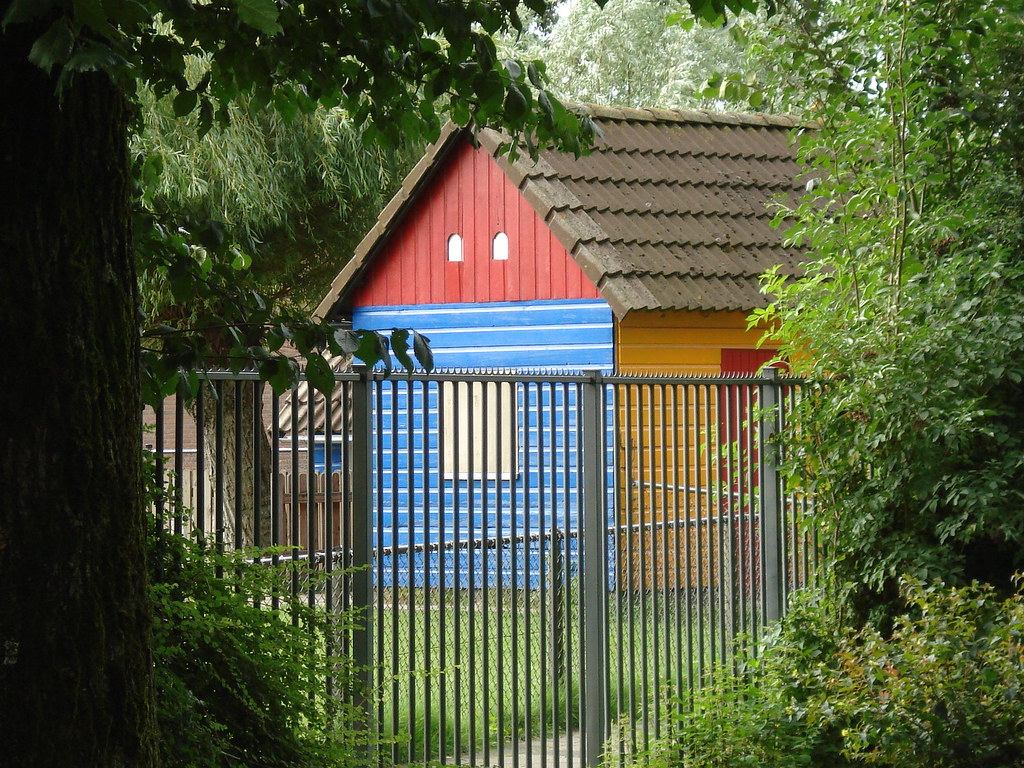 Colourful mini kids house in the garden