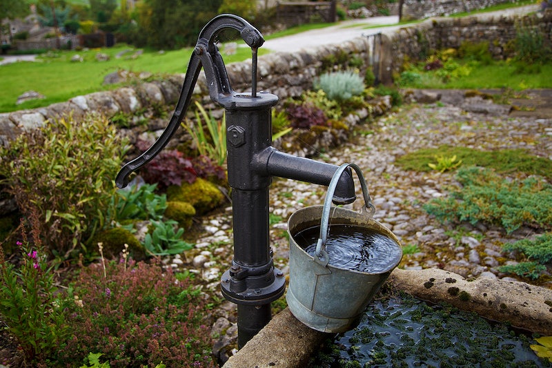 Tap filling bucket with water