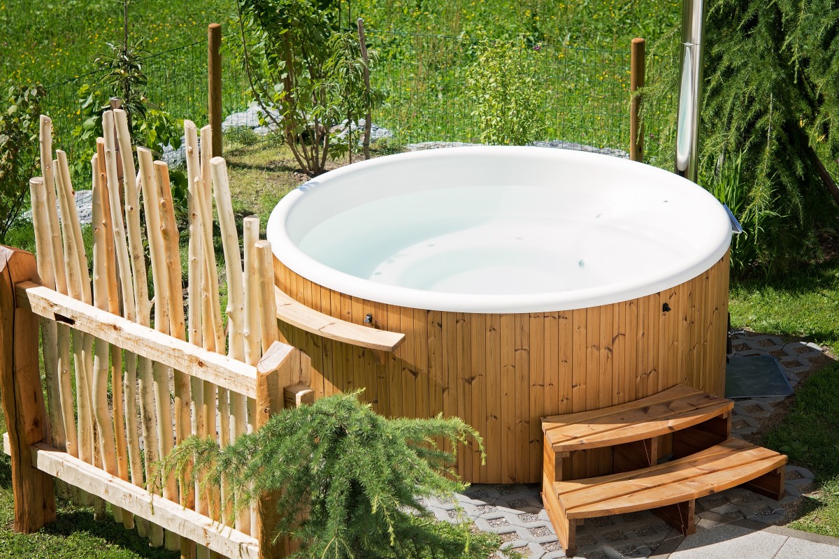 Bamboo outdoor hot tub with screening for privacy