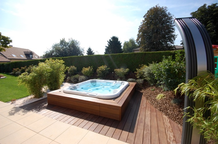 Backyard hot tub on a raised platform decking