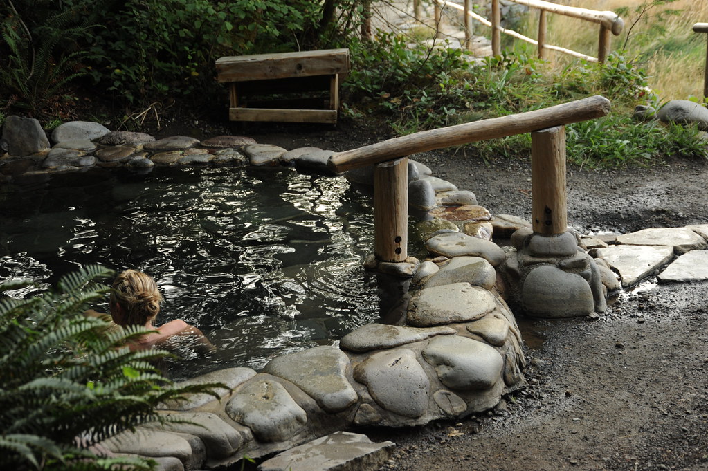 Wishing well-type outdoor hot tub stone