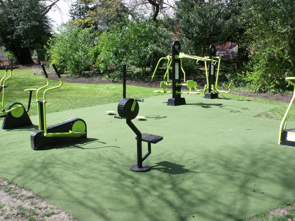 Outdoor gym area with various workout equipment