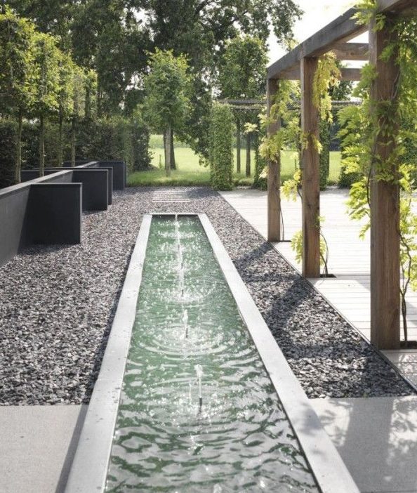Stunning long water feature with pebbles