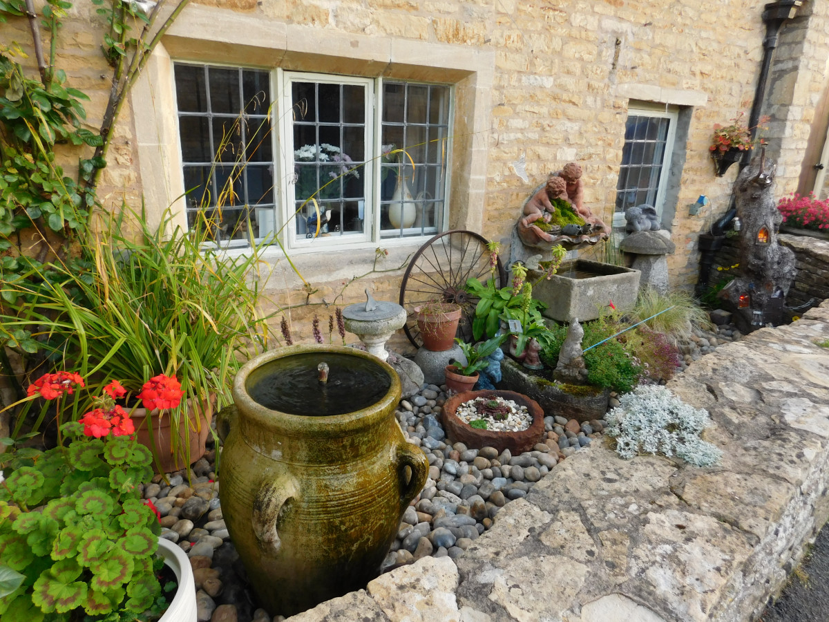 Small front yard rock garden with mini water feature