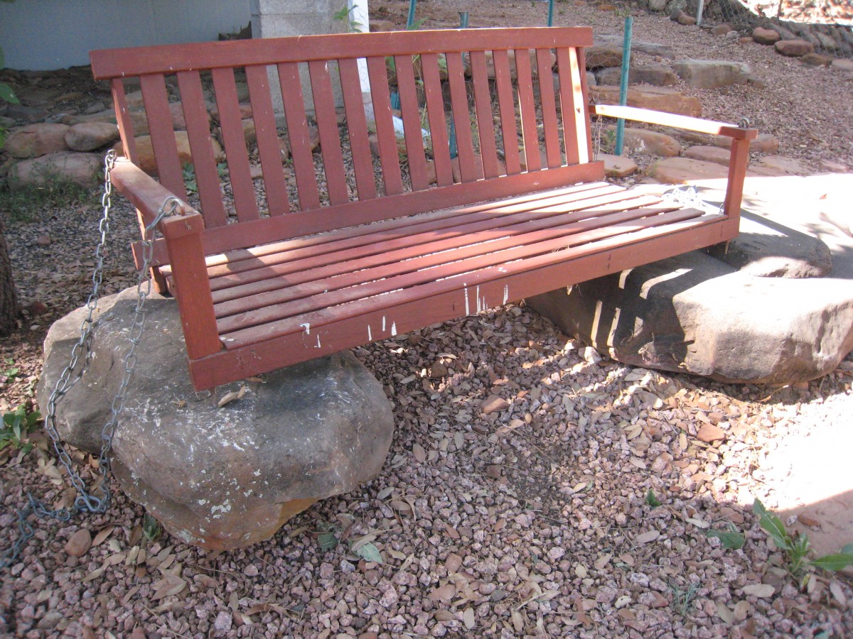 DIY seating with a red bench on top of two big rocks