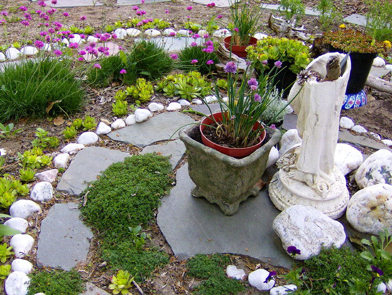 Spiral garden with pebbles and flowers