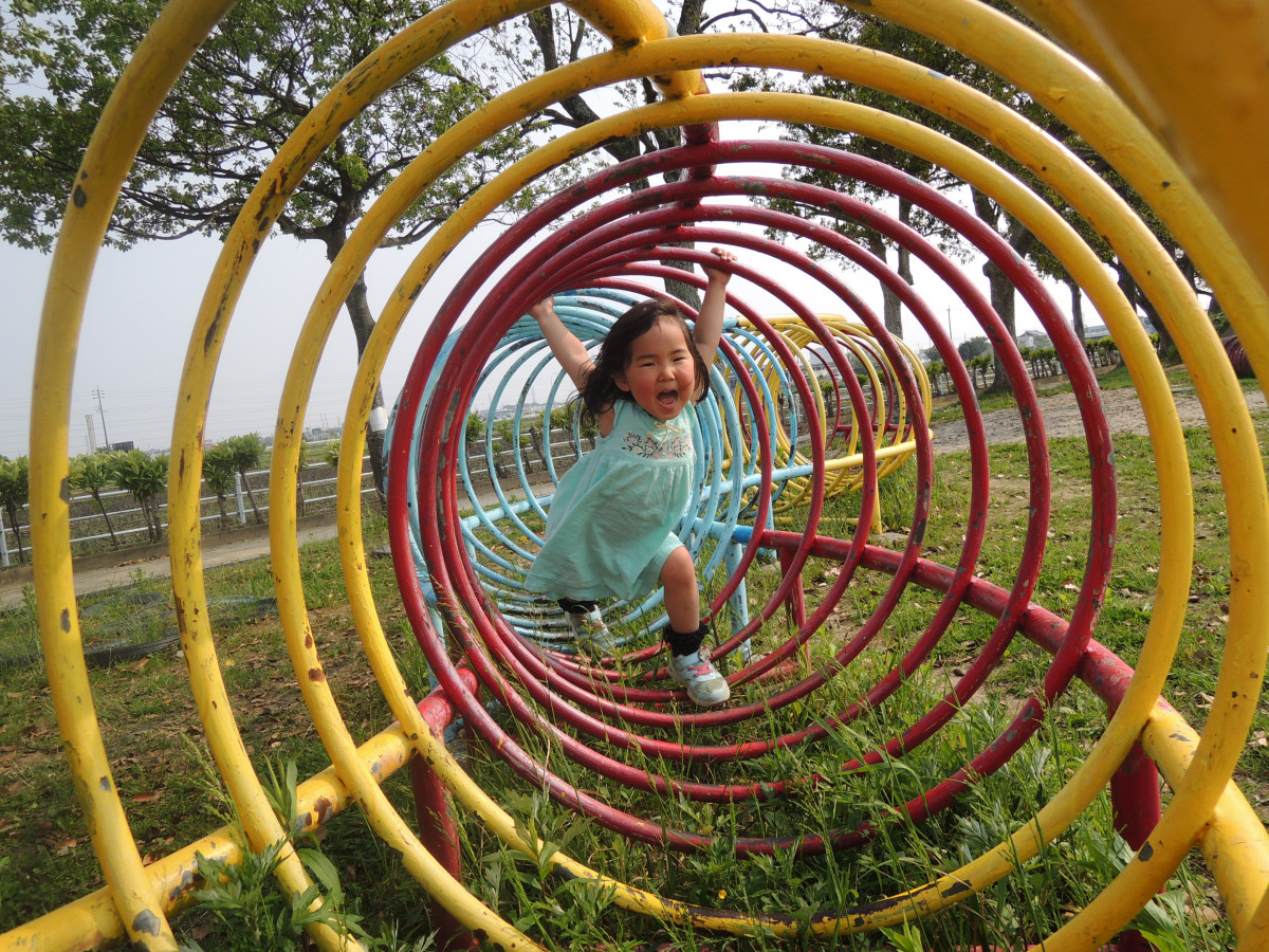 A kid inside a tunnel obstacle course