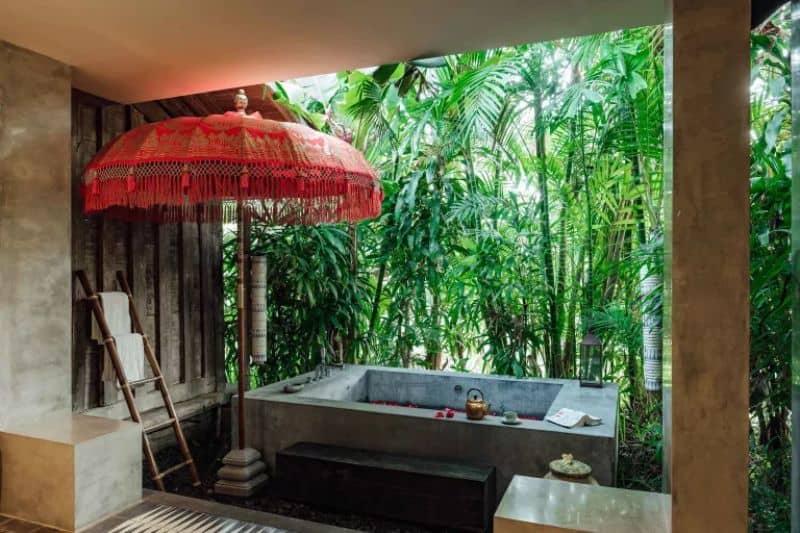 A mini hot tub decorated with tropical-inspired decors