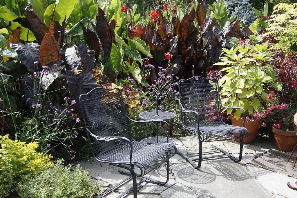 Tropical garden corner with seating area