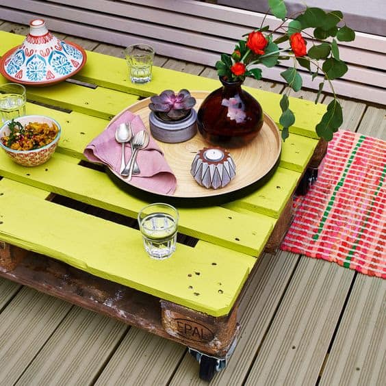 Pallet garden table painted in yellow green