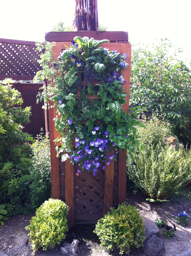 Vertical garden trellis with a hanging planter