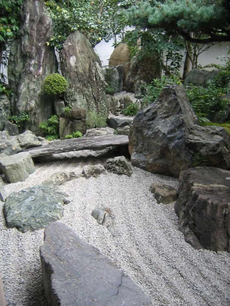 A dry waterfall with sand or gravel that represents as water