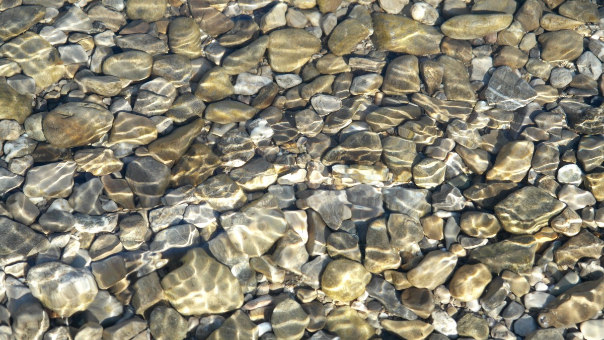 Pebble river with crystal clear water.