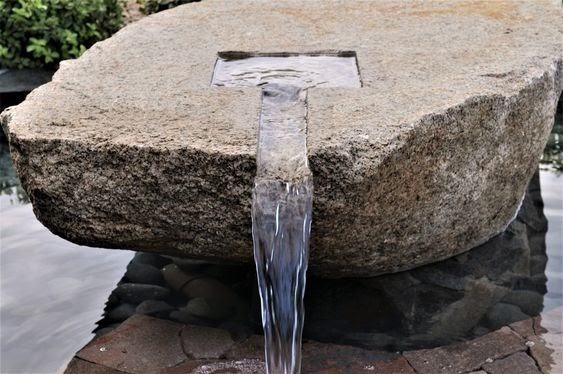 A natural, rustic looking rock fountain