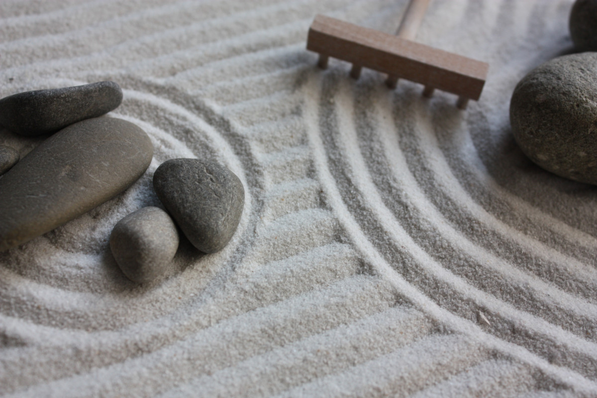 Zen sand spiral shapes with stones