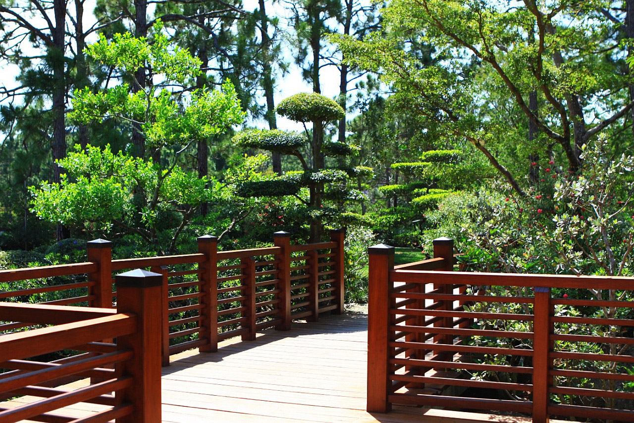 A Japanese garden with red fences