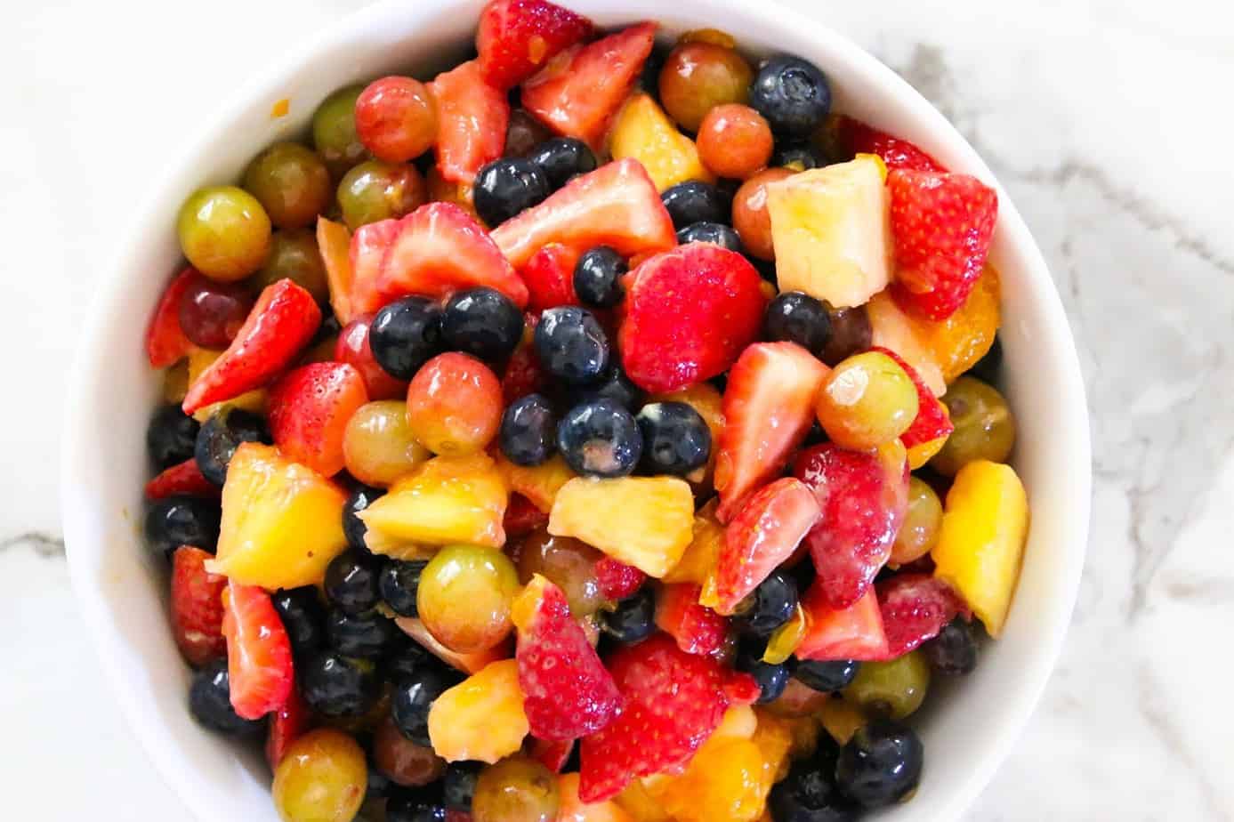 A healthy bow of fruit salad with variety of berries