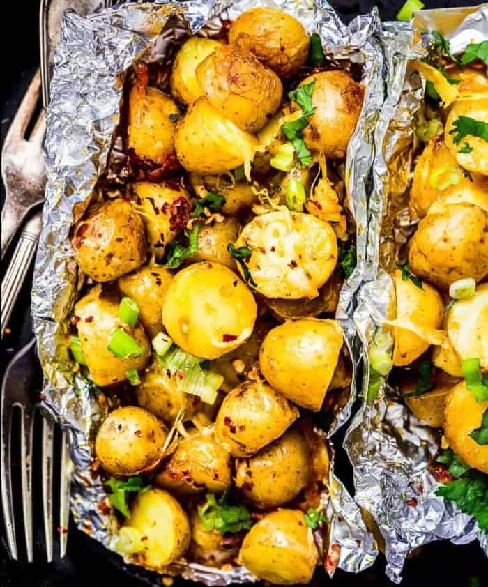 Cheesy campfire potatoes wrapped in tinfoil