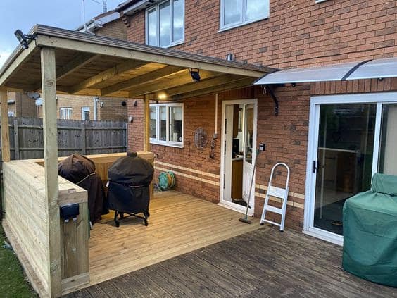 A BBQ area with a covered deck