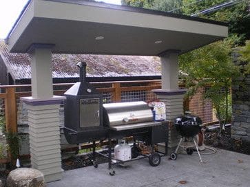 Open BBQ grilling area with a great roof and some spotlights