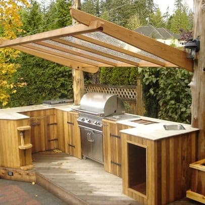 Wooden BBQ area with transparent roof