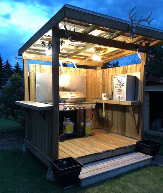 DIY wooden BBQ area with lights