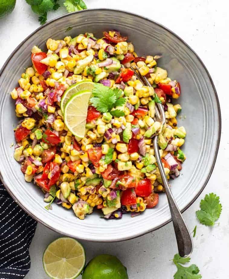 Grilled corn with avocado salsa in a bowl