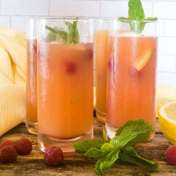 Fruity summer punch made with berries, topped with mint leaves