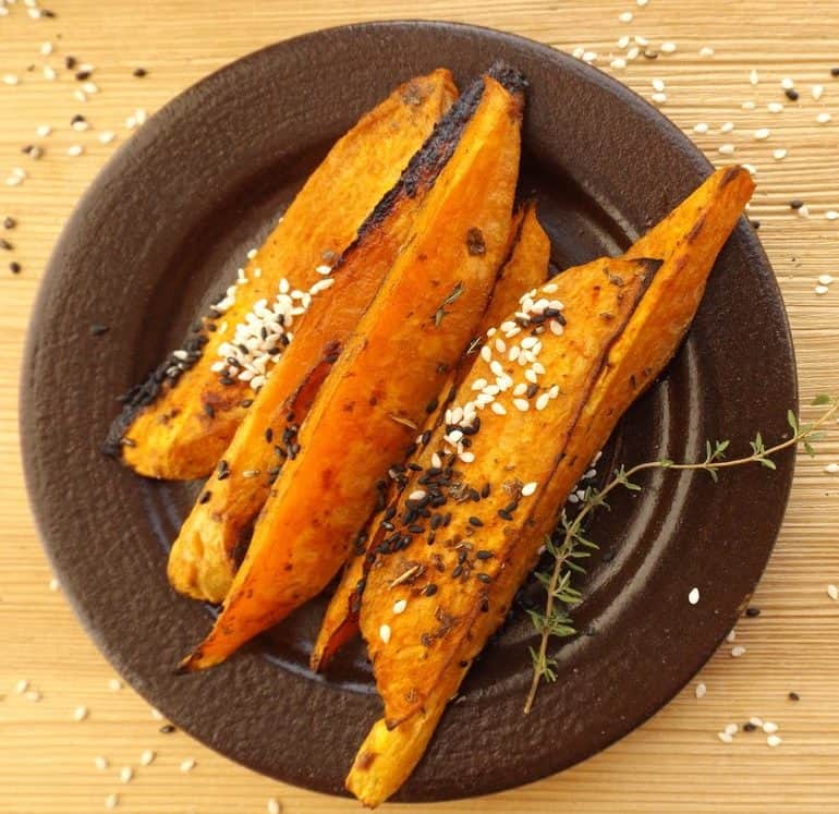 Grilled sweet potatoes sprinkled with sesame seeds