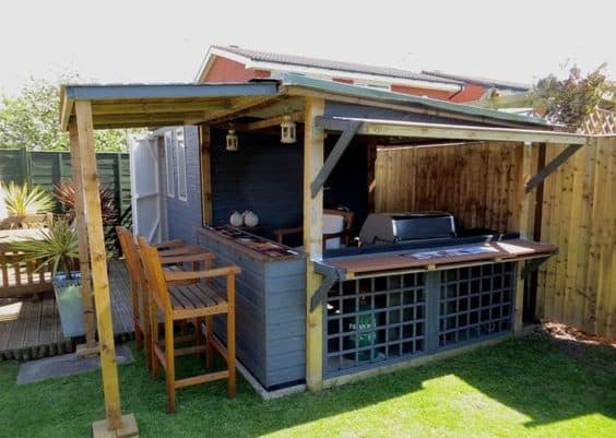 A garden BBQ set up in a shed building