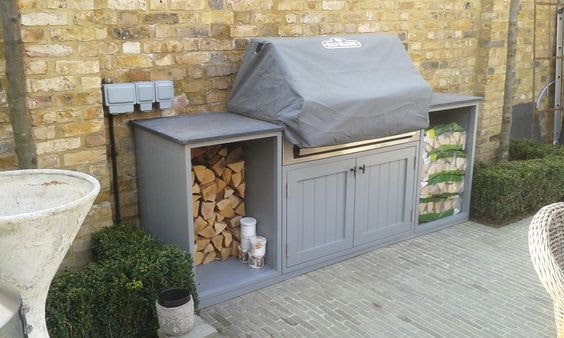 Simple grey BBQ area on wall