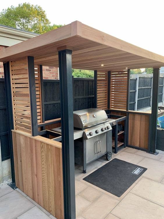 Enclosed wooden BBQ area in the poolside