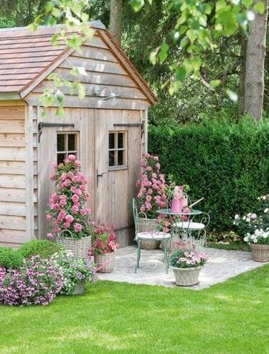A cosy seating area outside a small shed