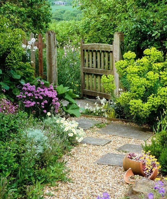 Pebbles are placed near the gate creating a winding, more natural outdoor path