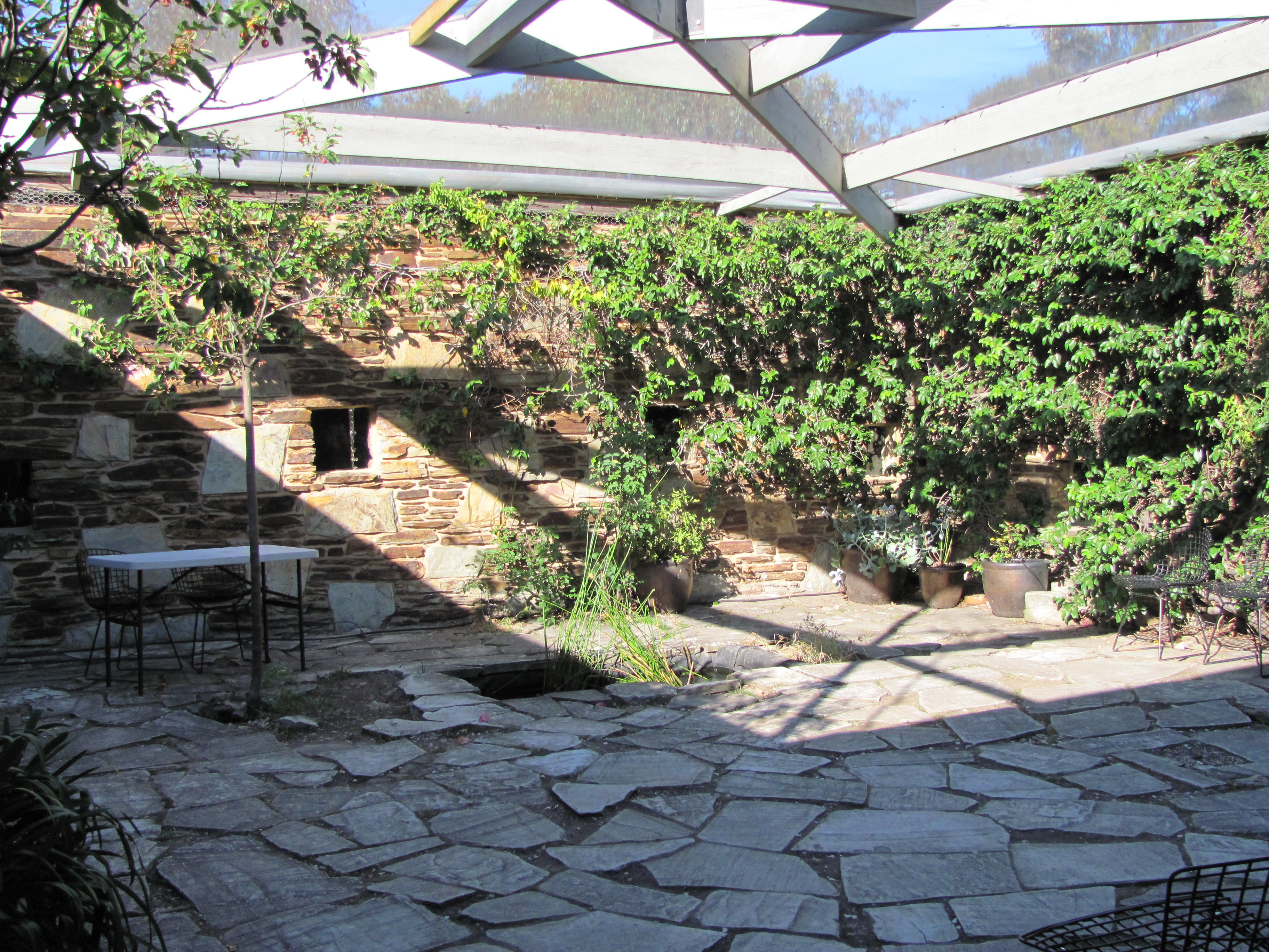 Courtyard with living wall and stone paving