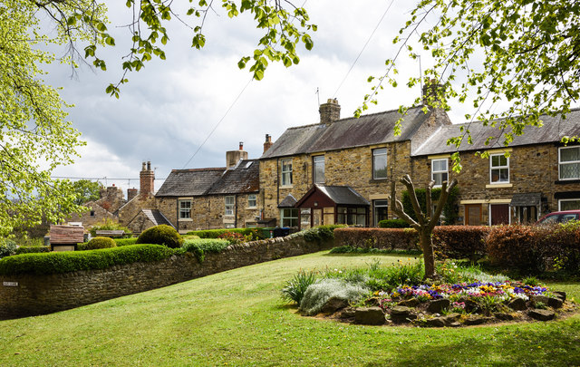 Formal square lawn in an English garden setting