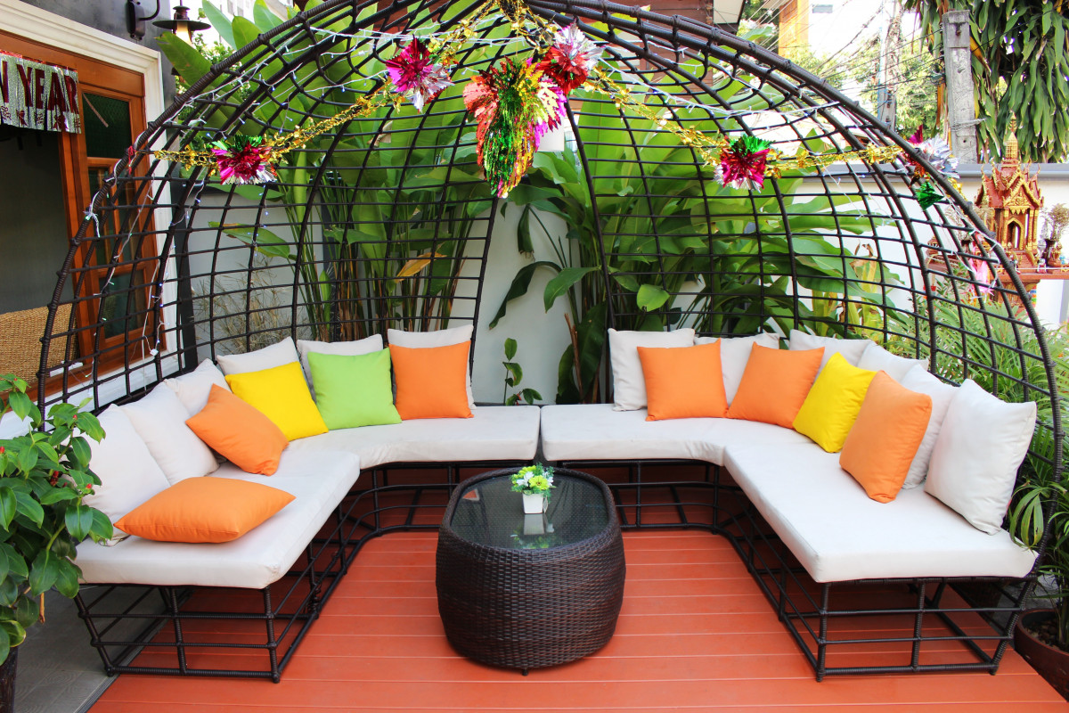 Round patio deck seating area with colourful cushions