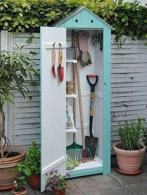 Cute small shed for storing garden tools and equipment