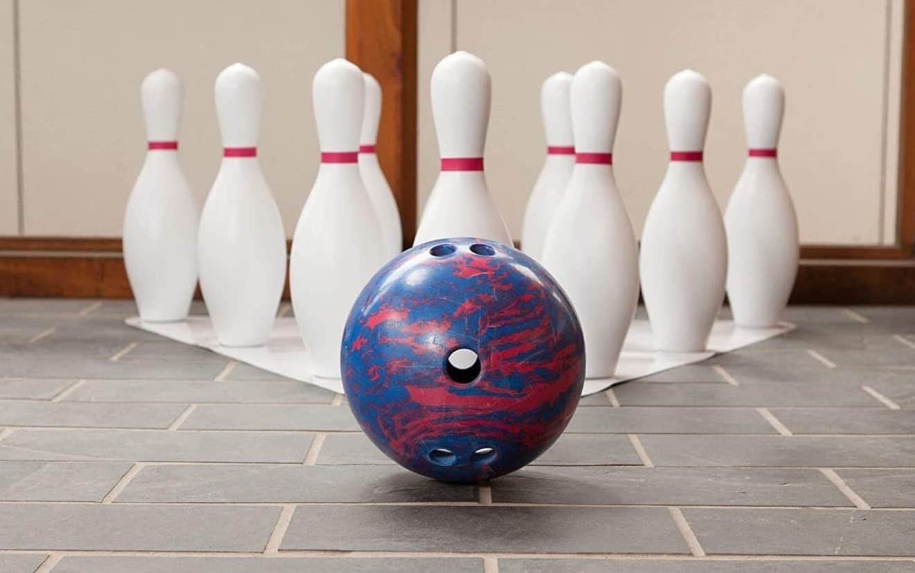 A bowling bowl and pins