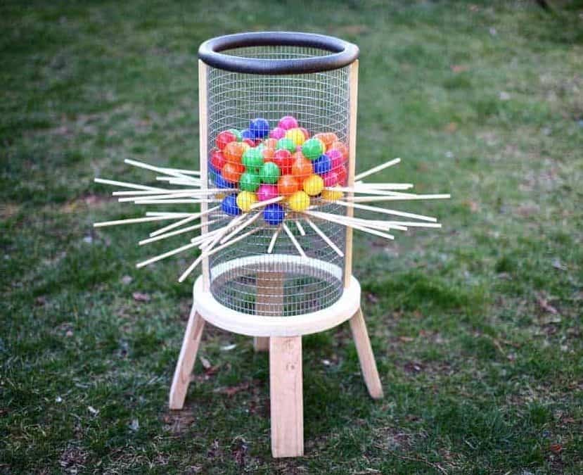 DIY giant kerplunk made of wooden and mesh materials