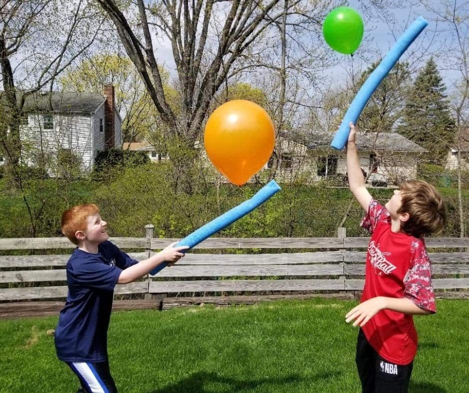 Children trying to keep up the balloon into the air